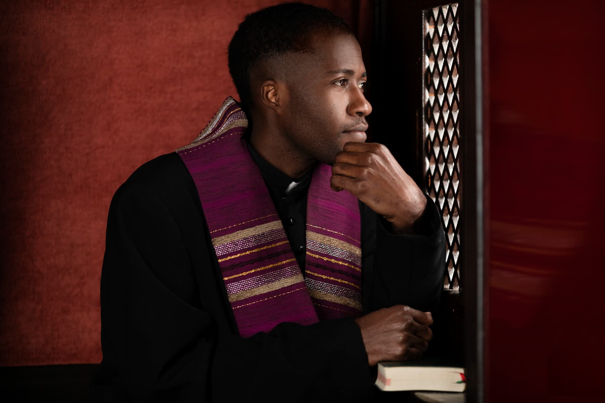 Calm reflective person in religious attire providing spiritual guidance